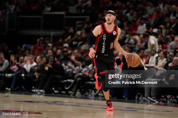 Alex Caruso of the Chicago Bulls dribbles the ball during the second half against the Atlanta Hawks at the United Center on April 01, 2024 in...