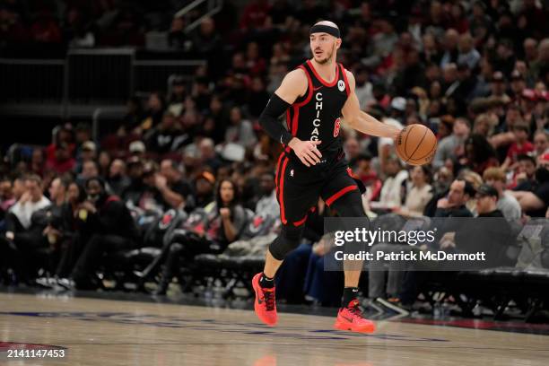 Alex Caruso of the Chicago Bulls dribbles the ball during the second half against the Atlanta Hawks at the United Center on April 01, 2024 in...