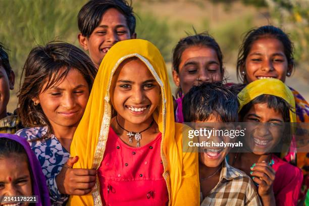 group of happy gypsy indian children, desert village, india - rajasthani youth stock pictures, royalty-free photos & images