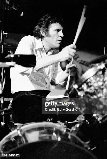American Rock musician Levon Helm plays drums as he performs onstage at the Lone Star Cafe, New York, New York, February 17, 1981.