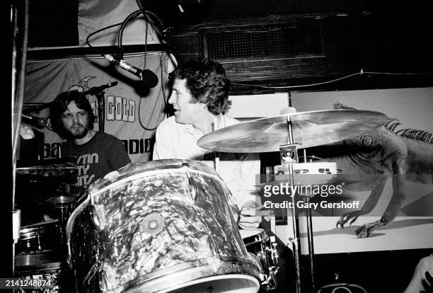 American Rock musician Levon Helm plays drums as he performs onstage at the Lone Star Cafe, New York, New York, February 17, 1981. Visible at left is...