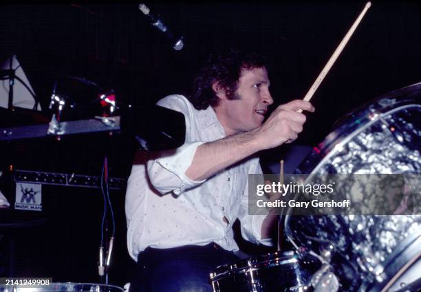 American Rock musician Levon Helm plays drums as he performs onstage at the Lone Star Cafe, New York, New York, February 17, 1981.