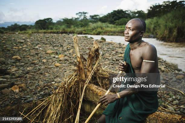 Young Suri Man In Village of Kibish, Omo Region, Southwest Ethiopia. Kibish, Ethiopia.