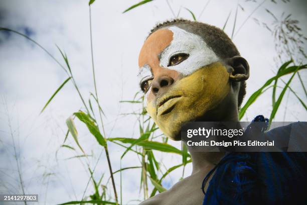 Surma Child With Face Painted With Pigment Made From Powdered Coloured Stones, Omo Region, Southwest Ethiopia. Kibish, Ethiopia.