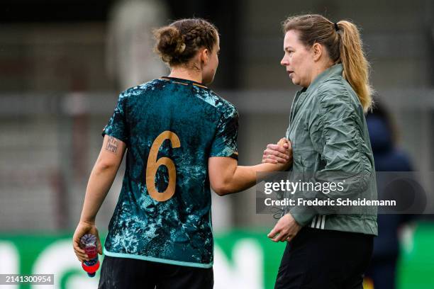 Head coach of Germany Kathrin Peter and Paulina Platner of Germany at Sportclub Arena on April 05, 2024 in Verl, Germany.