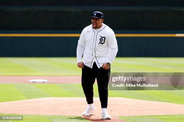 Penei Sewell of the Detroit Lions throws out the first pitch before a game between the Detroit Tigers and the Oakland Athletics at Comerica Park on...