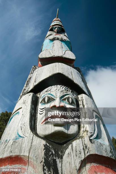 Totem pole extending skyward at the Haida Heritage Center. Skidegate, Haida Gwaii, British Columbia, Canada.