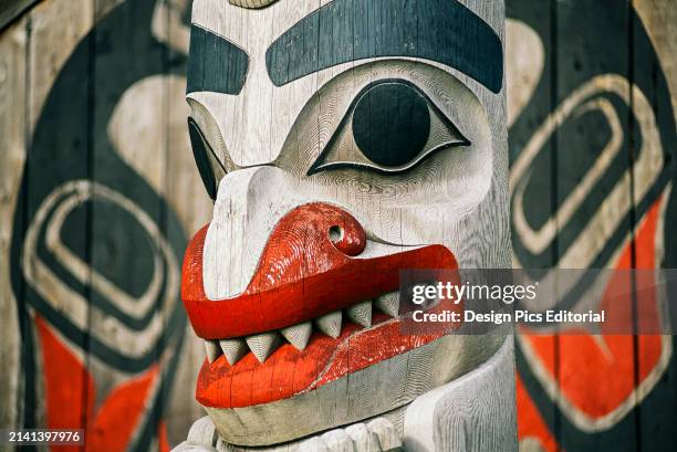 Detail of artwork on mortuary pole at town council of Old Massett, Haida Gwaii. Haida Gwaii, British Columbia, Canada.