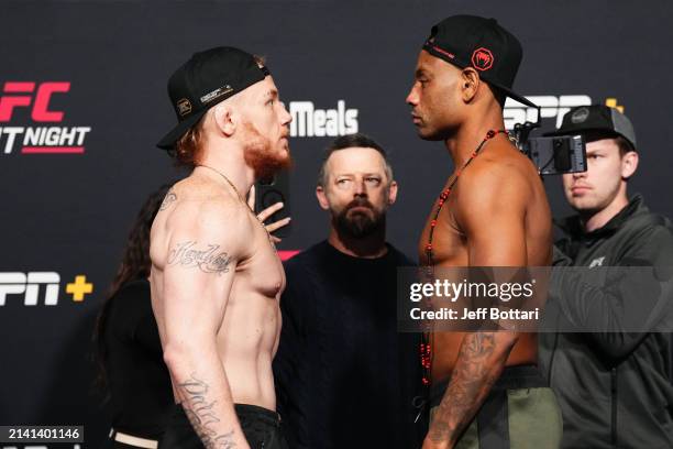 Opponents Dylan Budka and Cesar Almeida of Brazil face off during the UFC Fight Night weigh-in at UFC APEX on April 05, 2024 in Las Vegas, Nevada.