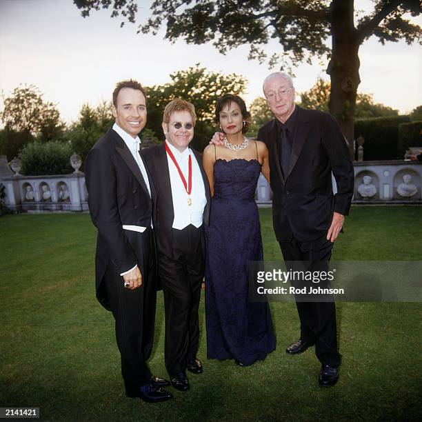 David Furnish, Sir Elton John, Shakira Caine and Sir Michael Caine attends The Fifth Annual White Tie And Tiara Ball that is held at the Elton John...