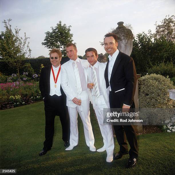 Elton John, Stephen Gately, Andrew Cowles and David Furnish attend The Fifth Annual White Tie And Tiara Ball that is held at the Elton John...