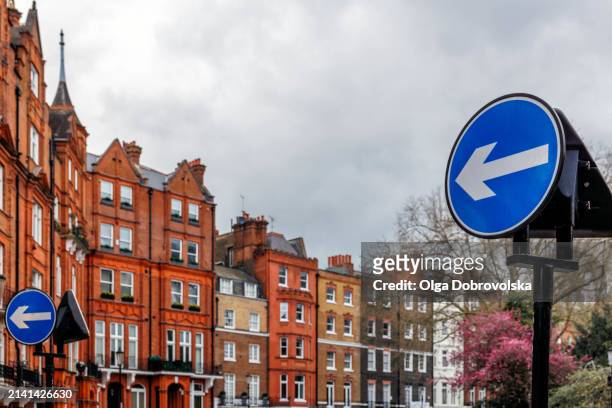 directional road signs at residential area - heaven icon stock pictures, royalty-free photos & images