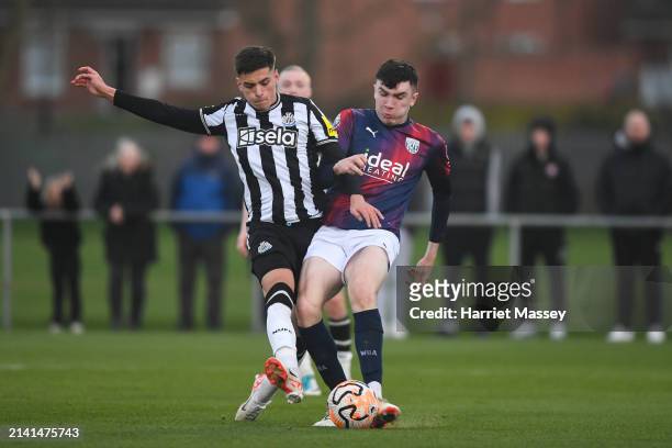 Ben Parkinson of Newcastle United and Jack McDowell of West Brom jostle for the ball during the Premier League 2 match between Newcastle United and...