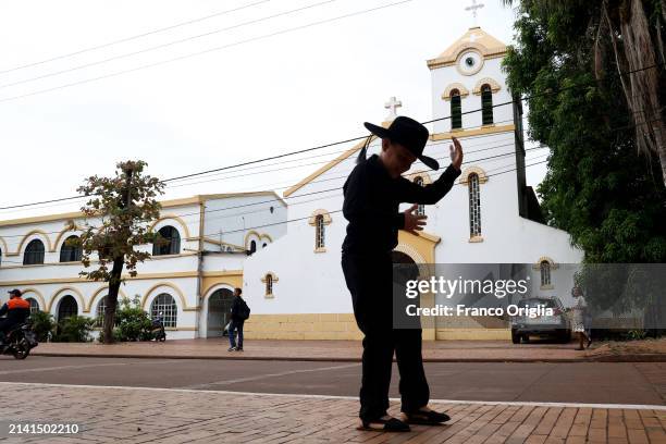 Boy dances in front of Puerto Carreño's cathedral 'Nuestra Señora del Carmen' on April 05, 2024 in Puerto Carreño, Colombia. Puerto Carreño is the...