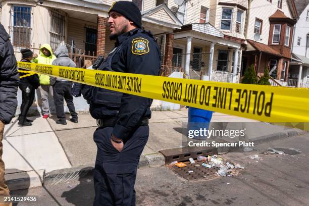 Residents and police gather outside of homes that were structurally damaged and had to be evacuated after New York City and parts of New Jersey...