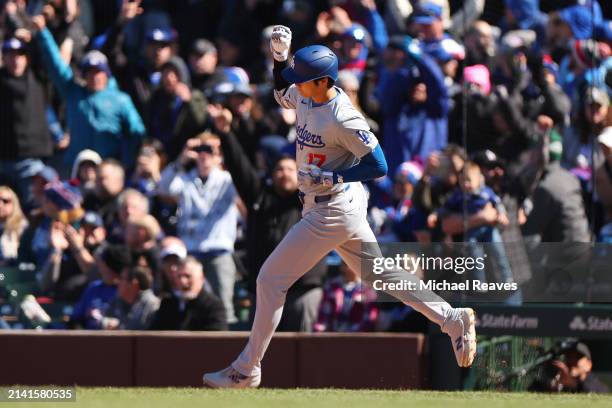 Shohei Ohtani of the Los Angeles Dodgers celebrates after hitting a two-run home run off Kyle Hendricks of the Chicago Cubs during the fifth inning...