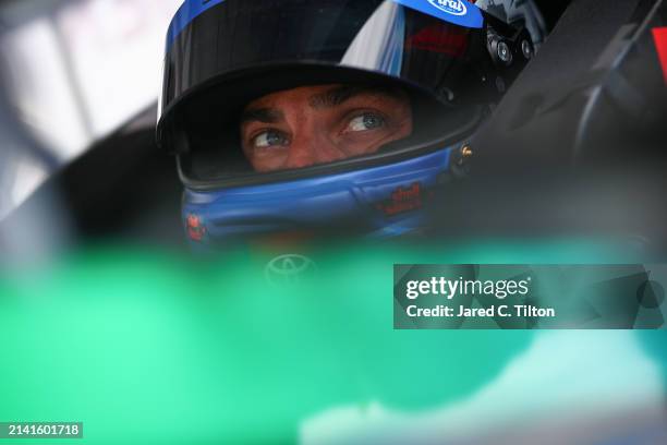 Stewart Friesen, driver of the Aim Autism/Halmar Toyota, looks on in his truck during qualifying for the NASCAR Craftsman Long John Silver's 200 at...