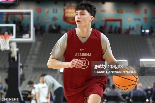 Kai Spears of the Alabama Crimson Tide dribbles the ball during a practice session at State Farm Stadium on April 05, 2024 in Glendale, Arizona.