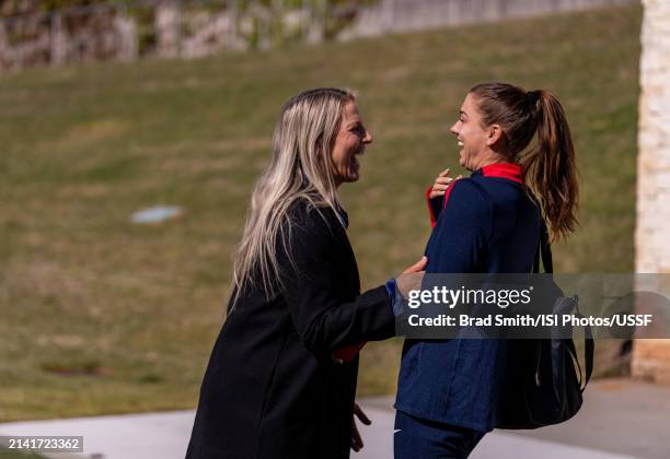 Alex Morgan of the United States talks with Julie Ertz before USWNT training at Children's Healthcare of Atlanta Training Ground on April 5, 2024 in...