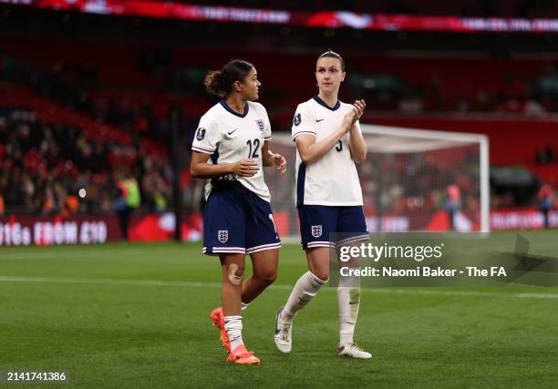 Jess Carter and Lotte Wubben-Moy of England acknowledge the fans following the UEFA EURO 2025 Women's Qualifiers match between England and Sweden at...