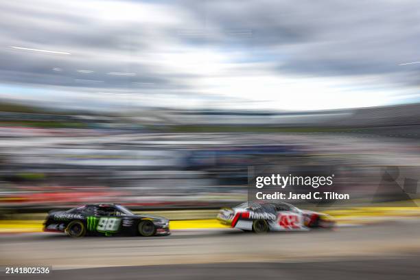 Leland Honeyman, driver of the RANDCO Chevrolet, and Riley Herbst, driver of the Monster Energy Ford, drive during practice for the NASCAR Xfinity...