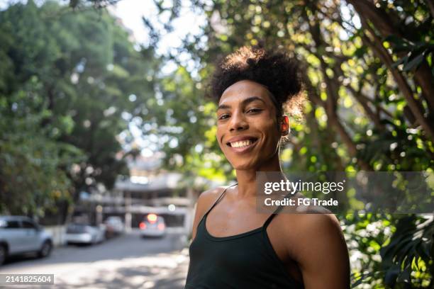 portrait of a transgender woman outdoors - transgender stock-fotos und bilder