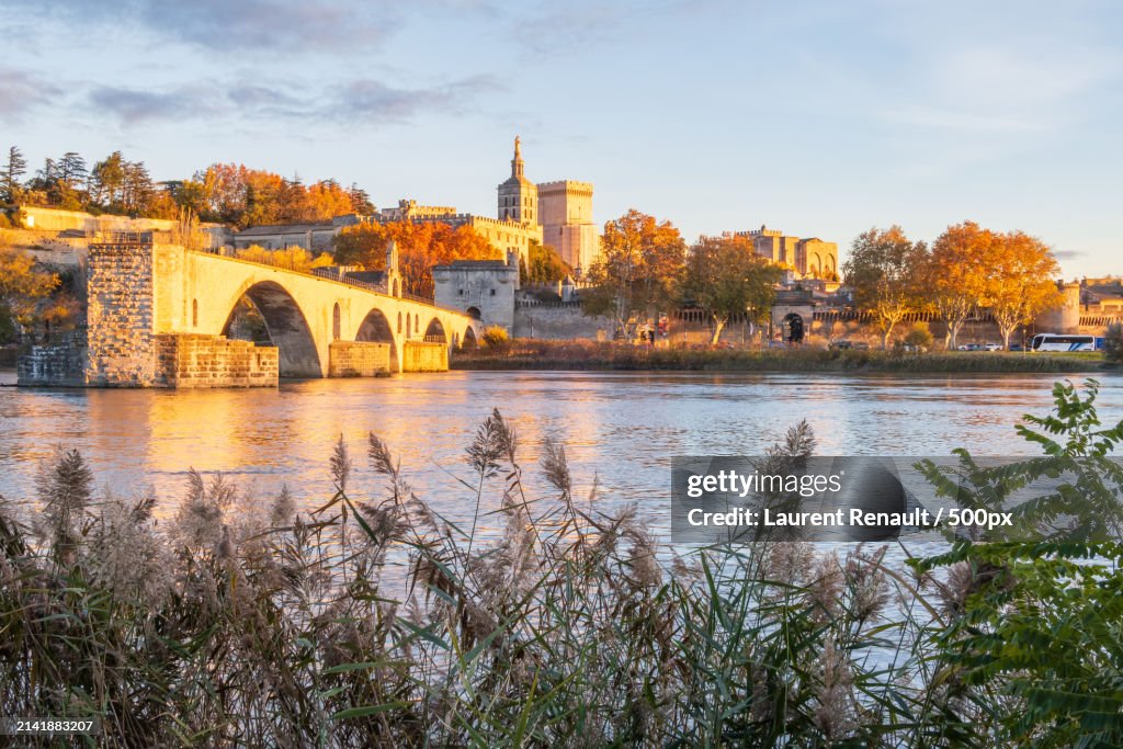 View of bridge over river against cloudy sky