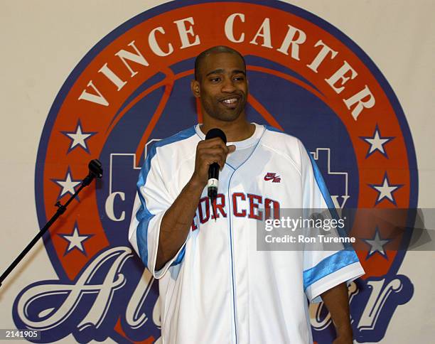 Vince Carter of the Toronto Raptors speaks to children during a practice session for the Vince Carter Charity All Star Game in Toronto, Ontario. NOTE...