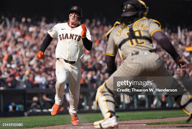 Matt Chapman of the San Francisco Giants rounds third base to score the winning run against the San Diego Padres in the bottom of the ninth inning at...