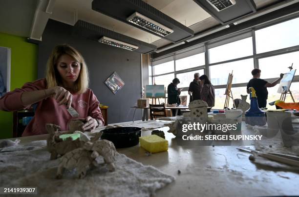 Women take part in an art therapy workshop titled "Live" and organised by the "Modern Ukraine" Charitable Foundation for women who lost their...