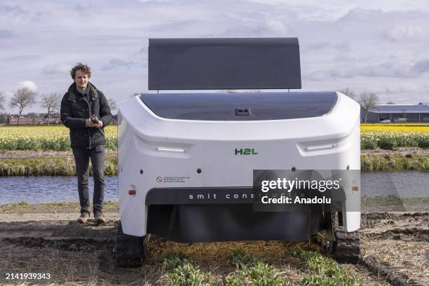 Allan Visser, a third generation tulip farmer shows 'Theo' in action, the H2L Robotics creation, an autonomous vehicle in the tulip fields, helping...