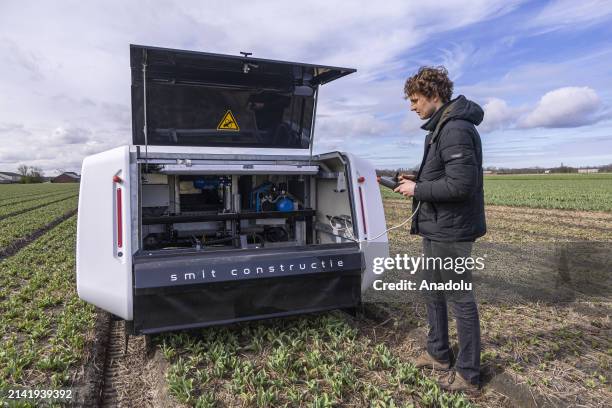 Allan Visser, a third generation tulip farmer shows 'Theo' in action, the H2L Robotics creation, an autonomous vehicle in the tulip fields, helping...