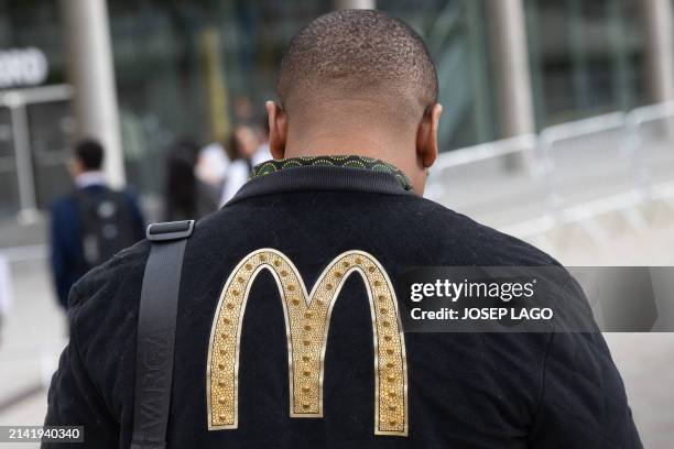 South Africa's team attendee arrives at the venue of the McDonald's Worldwide Convention, held at the Fira Gran Via in Barcelona, on April 8, 2024....