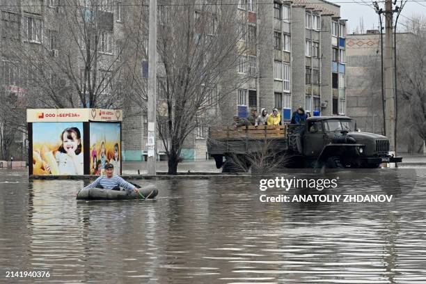 Picture taken on April 8, 2024 shows rescuers evacuating residents from the flooded part of the city of Orsk, Russia's Orenburg region, southeast of...