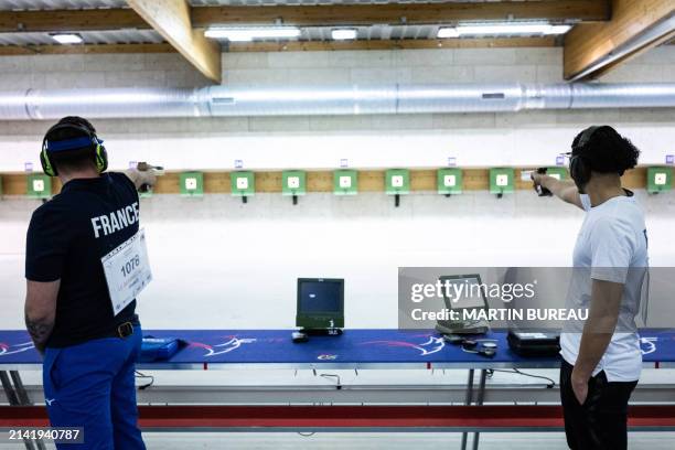 French athletes practice during the 10m air pistol training session, at the National Shooting Center , in Deols near Châteauroux, on April 8 where...