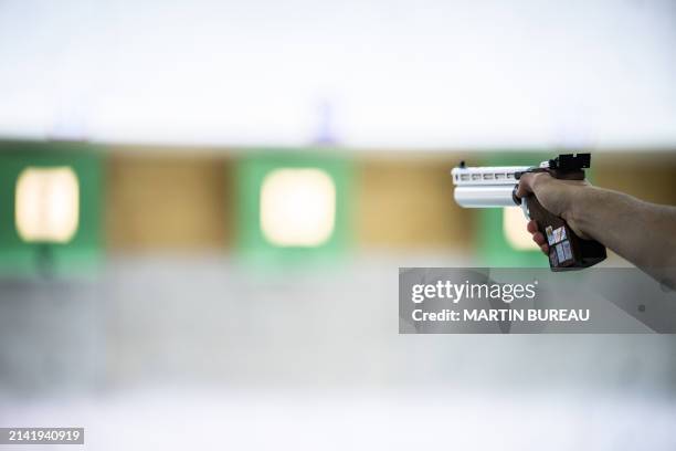 An athlete practices during the 10m air pistol training session, at the National Shooting Center , in Deols near Châteauroux, on April 8 where the...