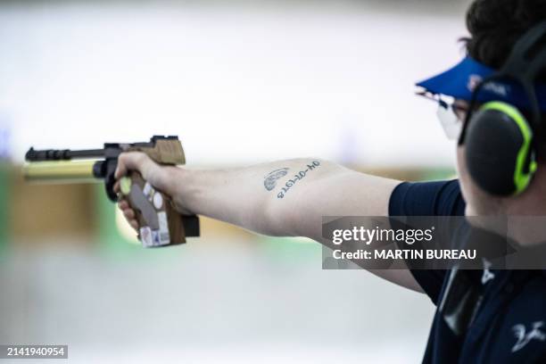 French Enzo Le Guirriec practices during the 10m air pistol training session, at the National Shooting Center , in Deols near Châteauroux, on April 8...