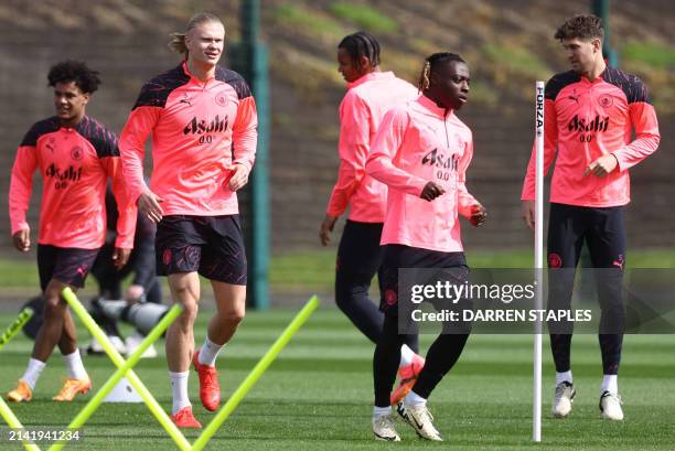 Manchester City's Norwegian striker Erling Haaland takes part in a training session on the eve of their UEFA champions league quarter final first leg...