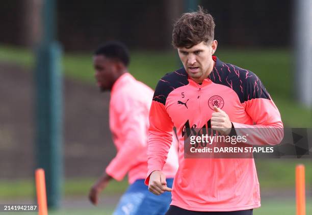 Manchester City's English defender John Stones takes part in a training session on the eve of their UEFA champions league quarter final first leg...
