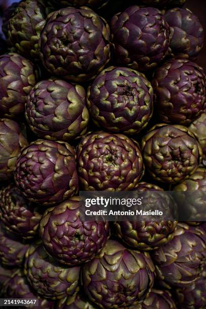 Fresh roman artichokes are displayed during the inauguration of the Festival of the Roman Artichoke at the Jewish quarter, on April 8 in Rome, Italy....