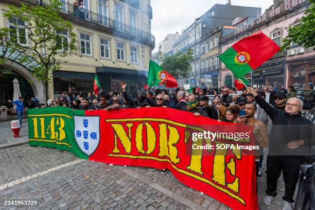 Anti-immigration sympathizers hold a banner during a far-right protest in the streets of Porto Around two hundred far-right protesters demonstrated...