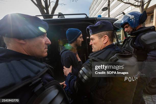 Police officers arrest an anti-fascist sympathizer during an anti-immigration protest. Around two hundred far-right protesters demonstrated in Porto...