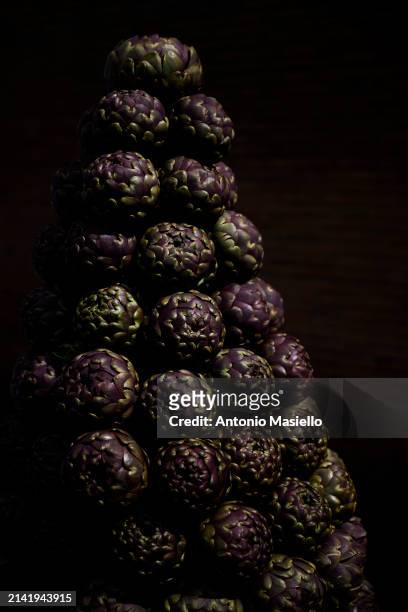 Fresh roman artichokes are displayed during the inauguration of the Festival of the Roman Artichoke at the Jewish quarter, on April 8 in Rome, Italy....