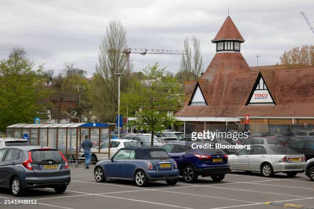 Cars in the car park outside a Tesco Plc supermarket in London, UK, on Monday, April 8, 2024. Tesco are due to report full-year earnings on...