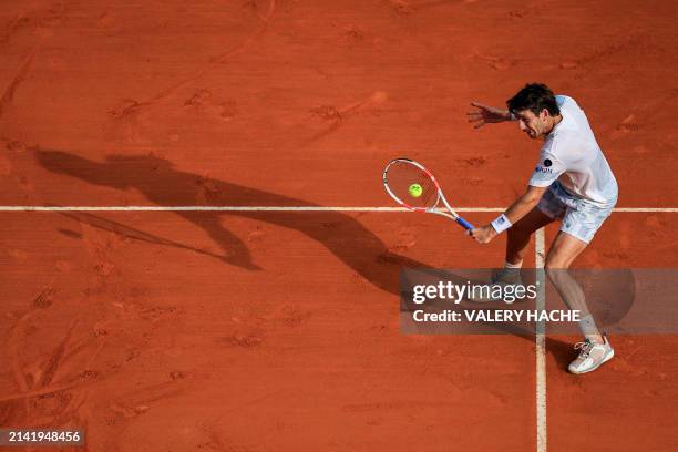 Britain's Cameron Norrie plays a backhand return to Russia's Karen Khachanov during their Monte Carlo ATP Masters Series Tournament round of 64...