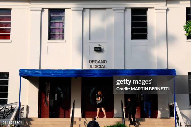 People enter the courthouse where the "Panama Papers" trial is being held in Panama City on April 8, 2024. 27 people will be tried starting on June 8...