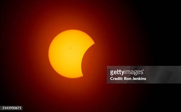 The moon begins to eclipse the sun on April 8, 2024 in Fort Worth, Texas. Millions of people have flocked to areas across North America that are in...