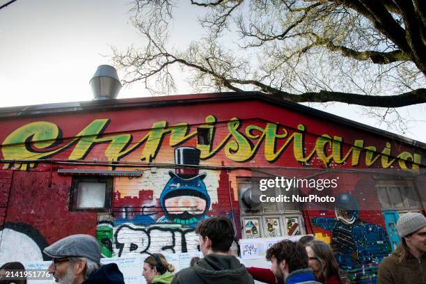 Residents of Christiania are jointly digging up the cobblestones at Pusher Street in Copenhagen, Denmark, on April 6 to officially mark the closure...