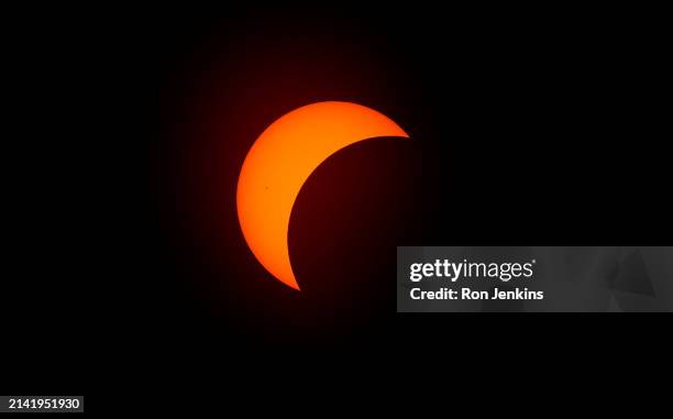 The moon begins to eclipse the sun on April 8, 2024 in Fort Worth, Texas. Millions of people have flocked to areas across North America that are in...