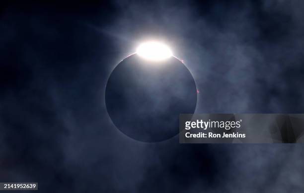 The diamond ring effect as well as Bailey's Beads are seen as the moon eclipses the sun on April 8, 2024 in Fort Worth, Texas. Millions of people...